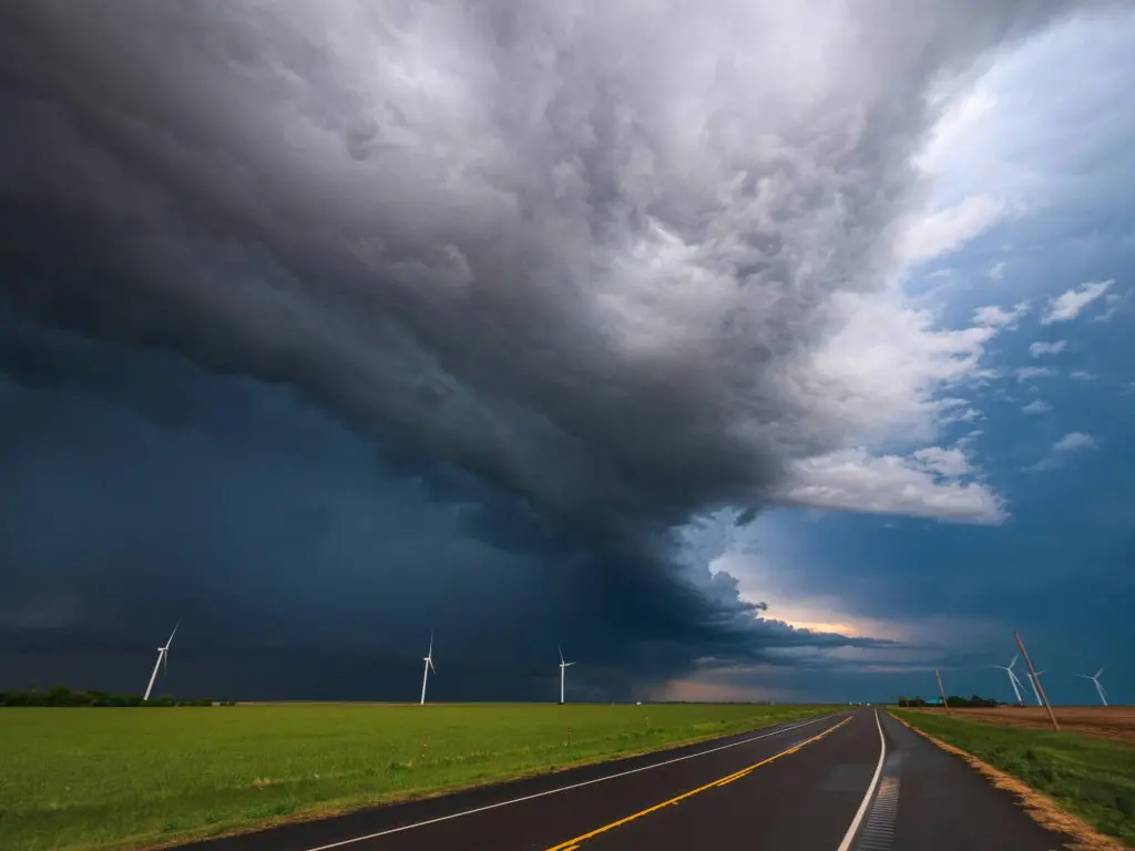 An ominous storm cloud at the end of a road