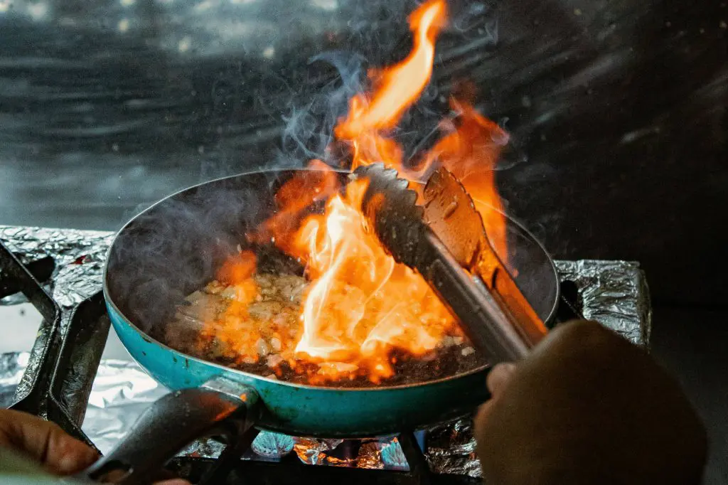 Two people cooking food