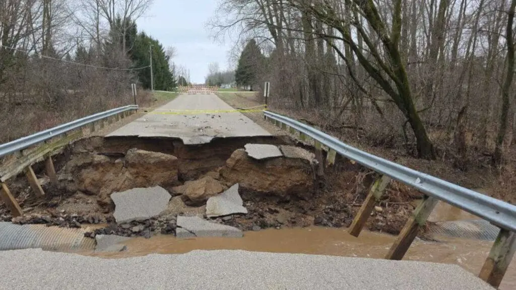 A road washed out after flooding in April 2026