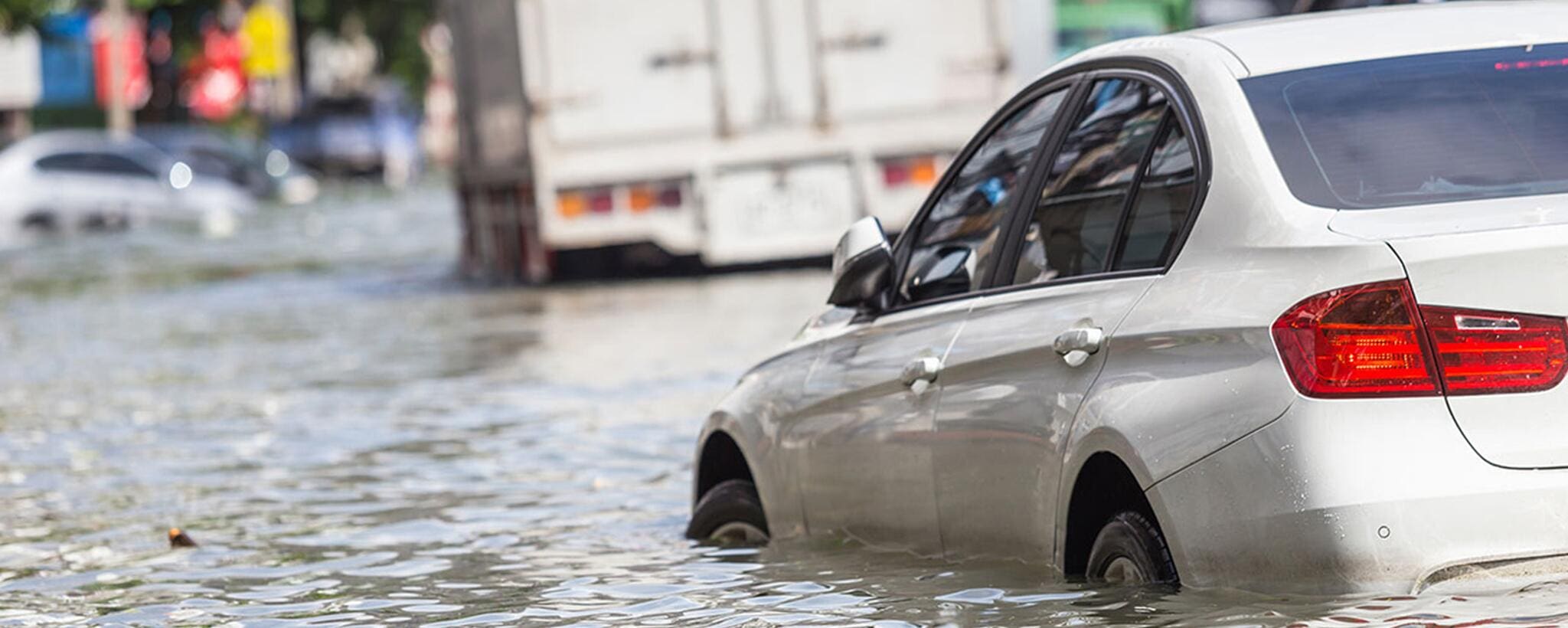 Cars and trucks stuck in flood waters