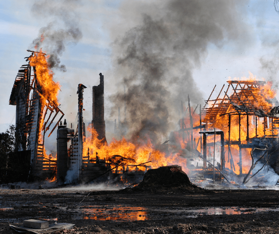 The flaming remains of a house as it burns down