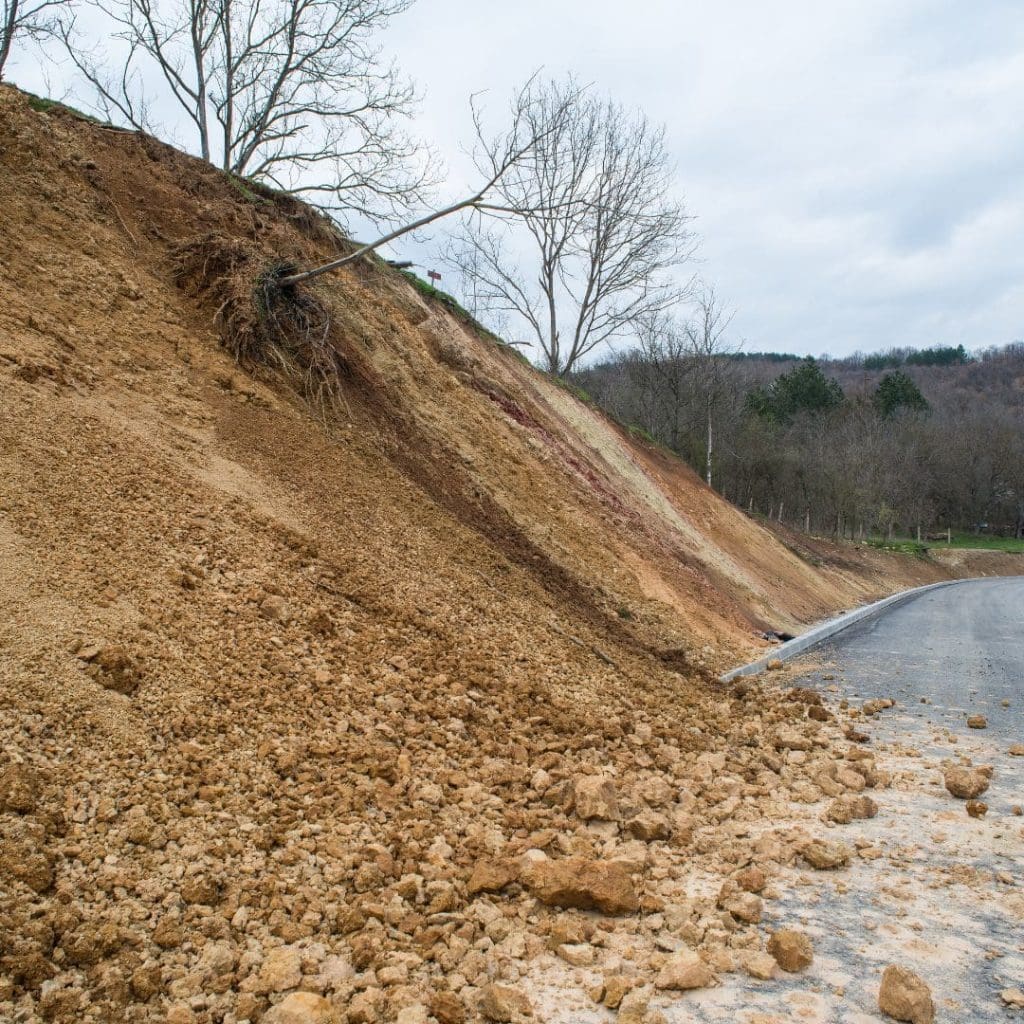 Landslide of rocks over a road