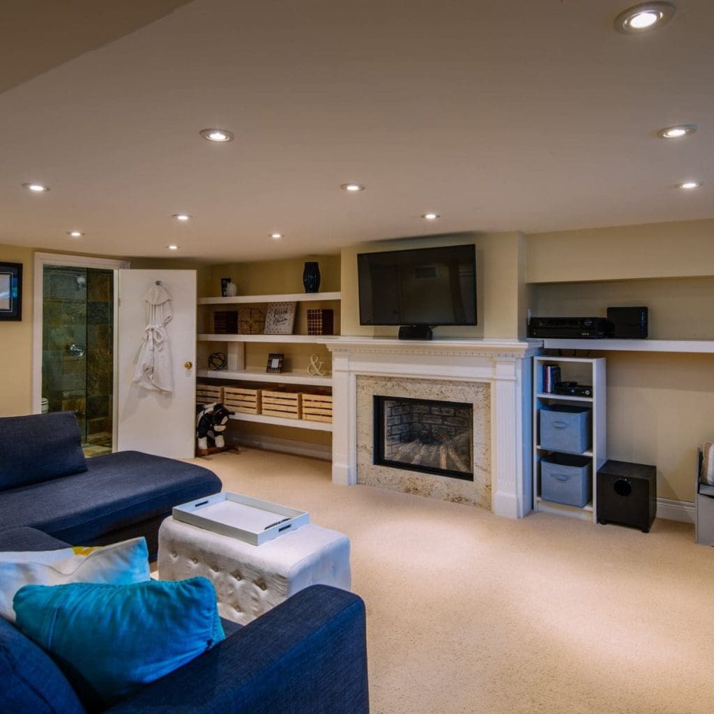 A family rec room with a TV and a fireplace