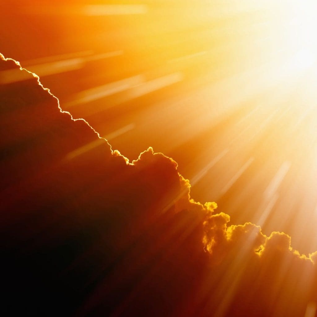 The sun shining through the clouds