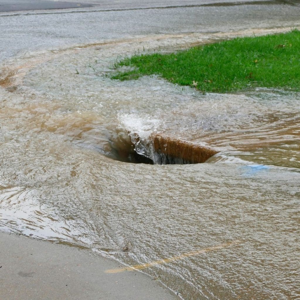 Street drain struggling to keep up with water